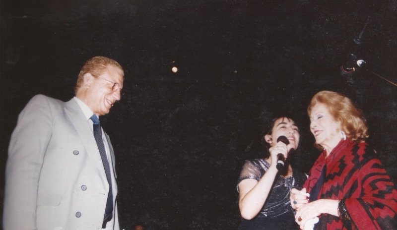 Saide next to Juan Adrian Ratti and Nelly Omar, artistic godmother
